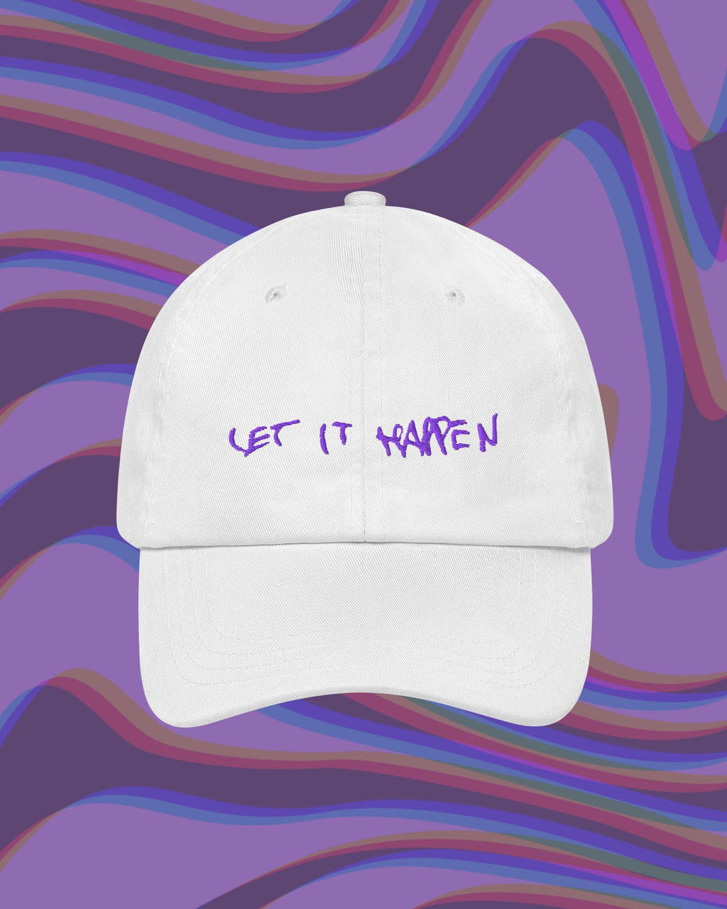 White embroidered hat with "Let it Happen " in purple, handwritten text